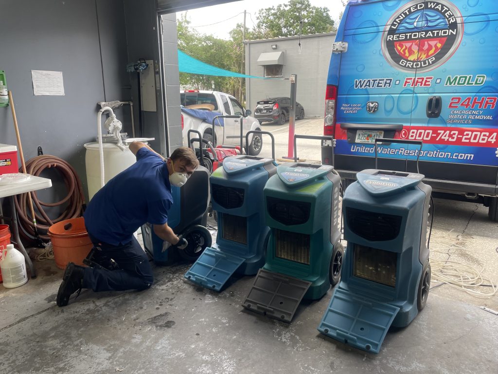 daytona-beach-water-restoration-dehumidifier-cleaning Professional water extraction equipment removing flood water during water damage restoration ormond beach, fl residential property.